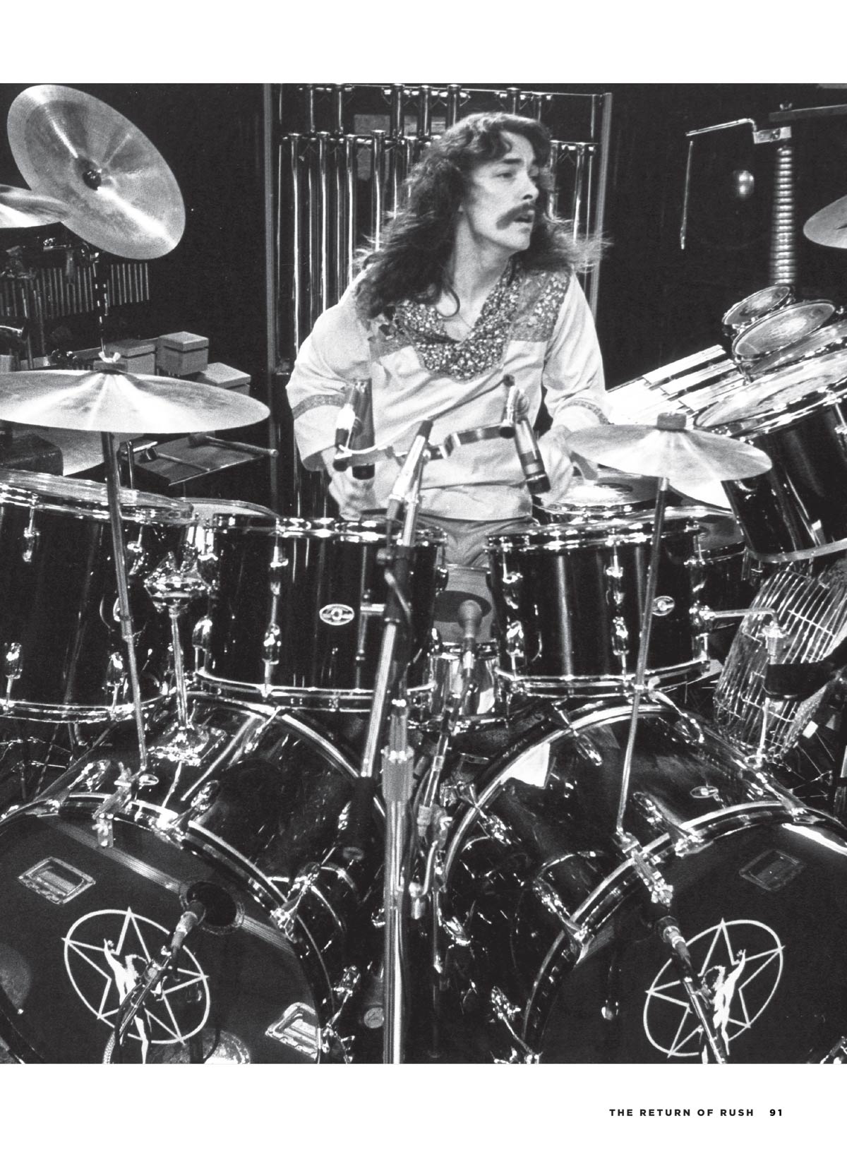 The Return Of Rush - The Fifty Something Tour: How The Band Honors A Tribute To Neil Peart, Tour Highlights, The Band’s Next Chapter, Their Iconic Era & More!