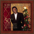 the album cover for Johnny Mathis - Johnny Mathis Gold: A 50th Anniversary Christmas Celebration