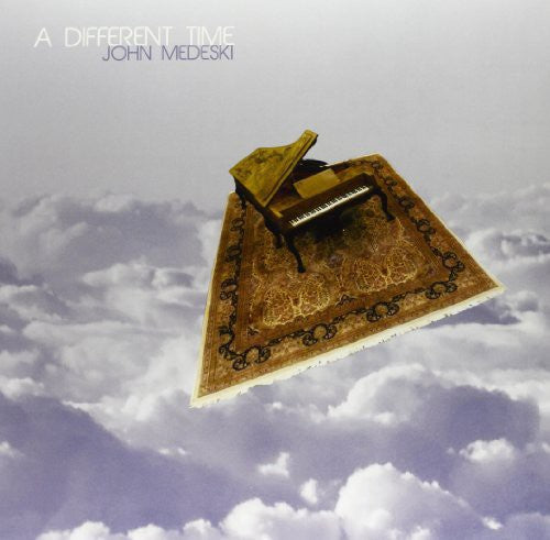 the album cover for John Medeski - Different Time