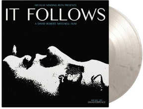 the album cover for Disasterpeace - It Follows (Original Soundtrack) - Limited 180-Gram Black & White Marble Colored Vinyl