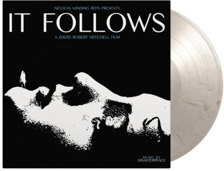 the album cover for Disasterpeace - It Follows (Original Soundtrack) - Limited 180-Gram Black & White Marble Colored Vinyl