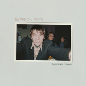 the album cover for Saffron Eyes - Smile Until It Hurts