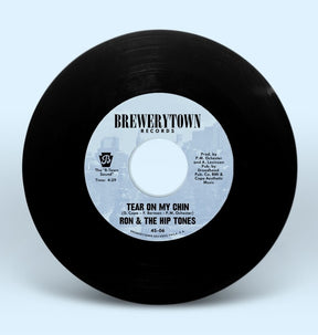 the album cover for Ron & The Hip Tones - Tear On My Chin B/W People (Feat. Ursula Rucker)