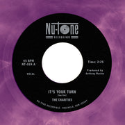 the album cover for The Charities - The Charities - It's Your Turn / Strangers [45]