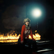 the album cover for Melanie Baker - Somebody Help Me, I'm Being Spontaneous