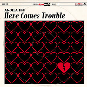 the album cover for Angela Tini - Here Comes Trouble [Deluxe] (Post)