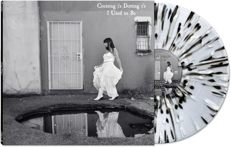 the album cover for Crossing I's Dotting T's - I Used To Be [BLACK/WHITE/CLEAR SPLATTER]