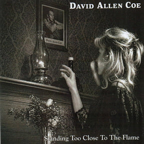 the album cover for David Allan Coe - Standing Too Close To the Flame