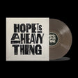 the album cover for Joy Oladokun - Hope Is A Heavy Thing [Transparent Black Ice]